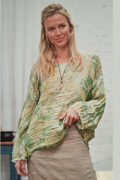 La Bottega Di Brunella open, wave textured linen, box fit top. Features a wide boatneck and long sleeve.
